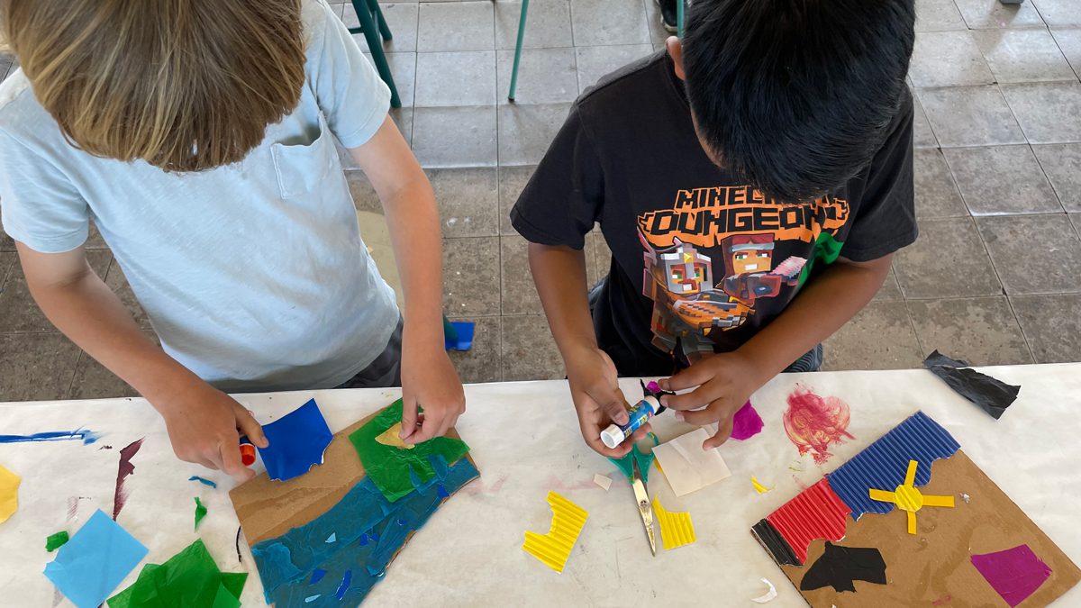 Children doing artwork with colorful material