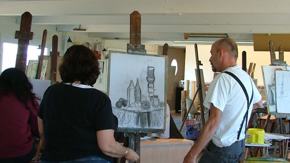 A couple of people watching a black and white sketch