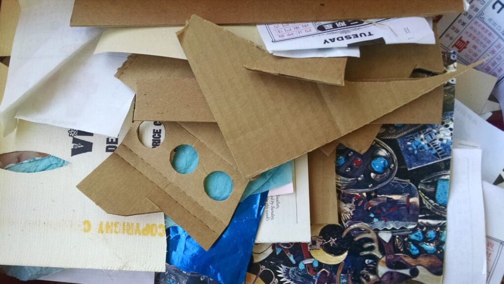 Pile of discarded cardboard and paper.