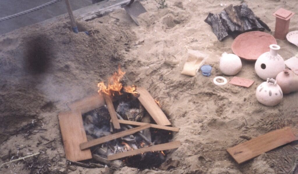 Raku firing: pottery in a wood fire.